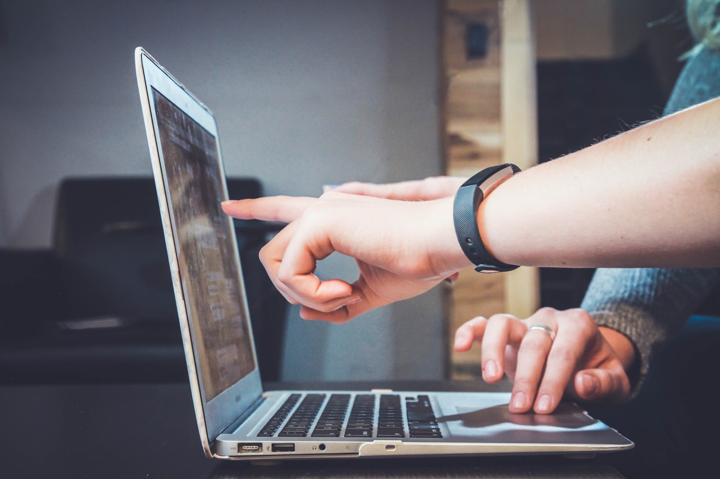 Professional reviewing digital resources on a laptop